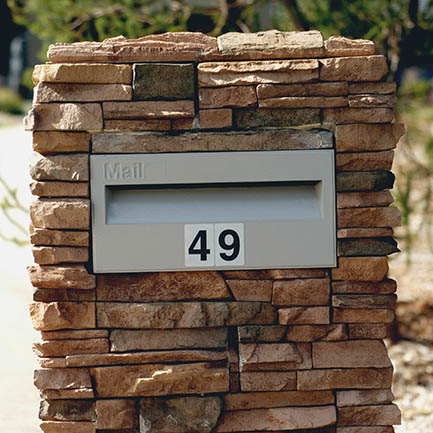 letterbox within a brick wall